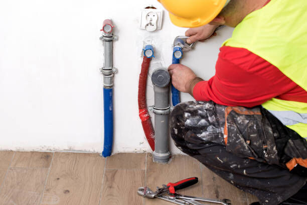 A worker using an advanced tool to inspect a drain pipe.